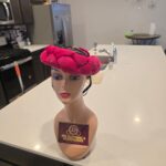 Hair band turban with rose at the back.