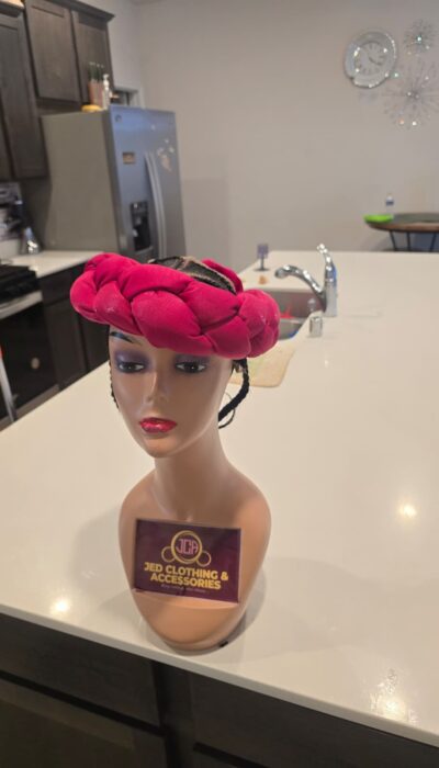 Hair band turban with rose at the back.